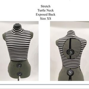 Stretchy, black and white, crop-top shirt.